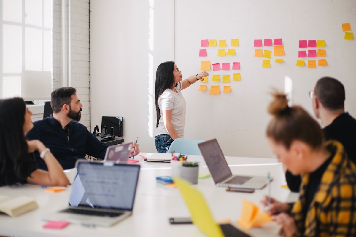Consultants collaborating with a business team